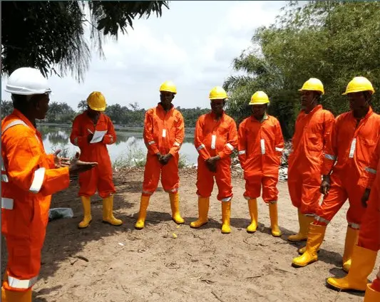 HSE toolbox talk with crew in full PPE
